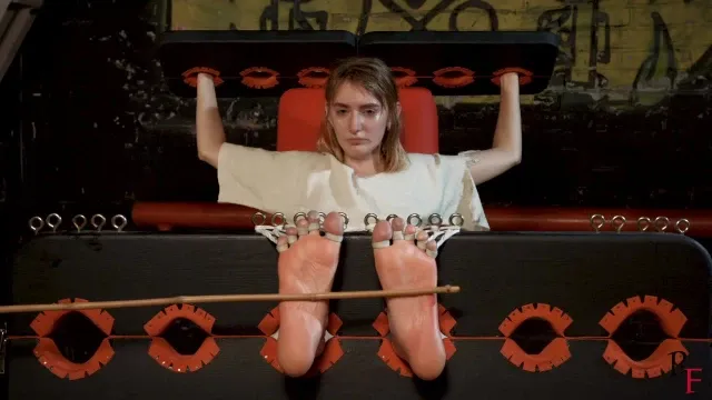 Katrina Suffers. Bastinado Training in Stocks