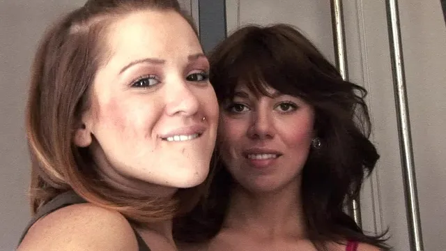 Mila and mishy play with a strap on dildo and fuck each other with it